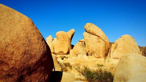 Rock formations against blue sky