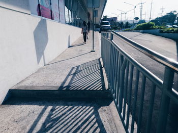 Staircase in city against sky