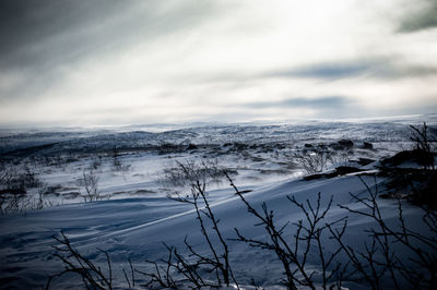 Scenic view of the windy snowcapped hills in lapland. utsjokl, finland. 