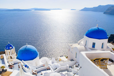 Panoramic view of sea and buildings against sky