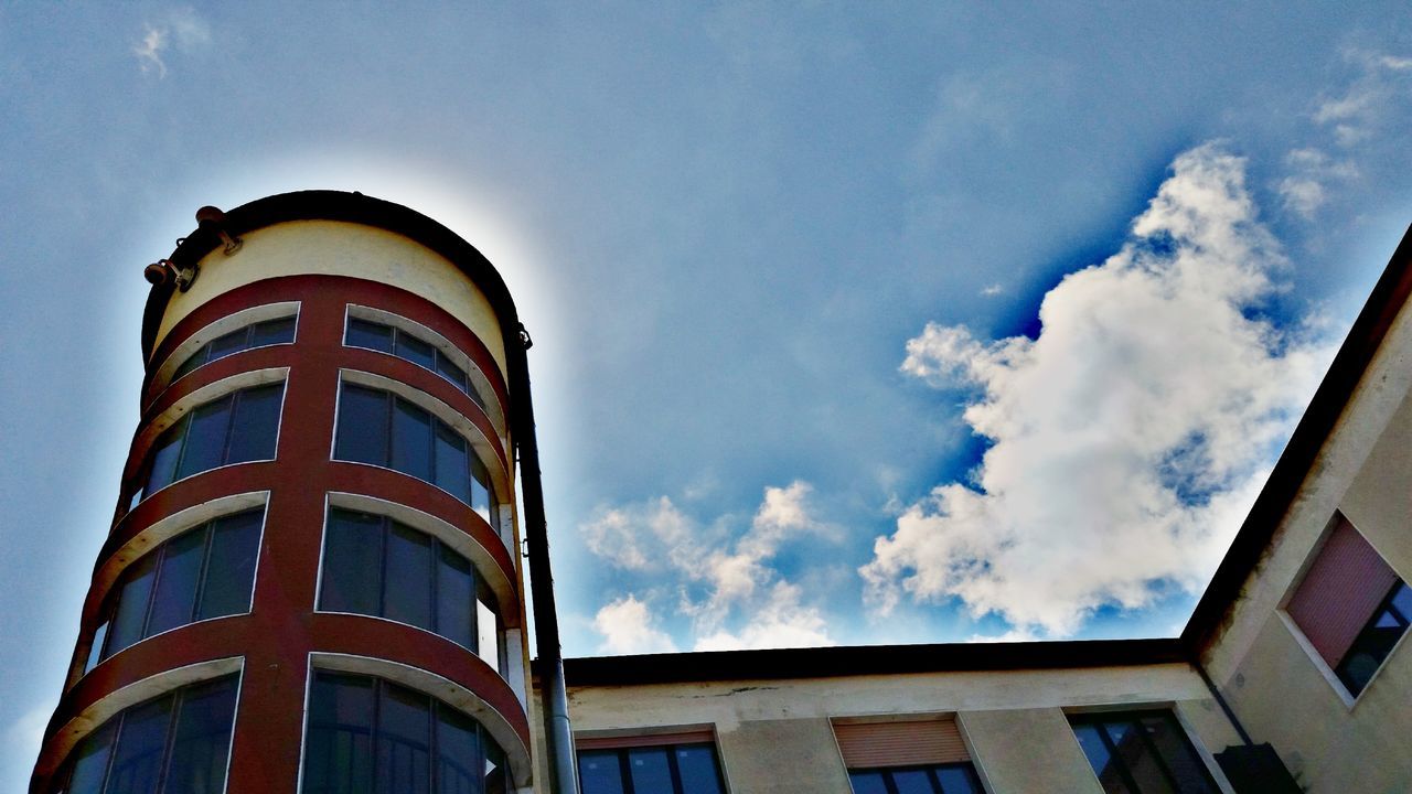 sky, built structure, cloud - sky, building exterior, architecture, low angle view, building, nature, day, no people, window, outdoors, tower, city, residential district, blue, tall - high, glass - material, high section, lighthouse