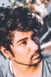 Close-up of young man looking away