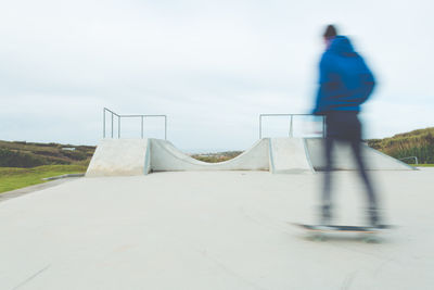 Low angle view of teenager at skateboard park