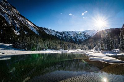 Scenic view of snowcapped mountains against sky