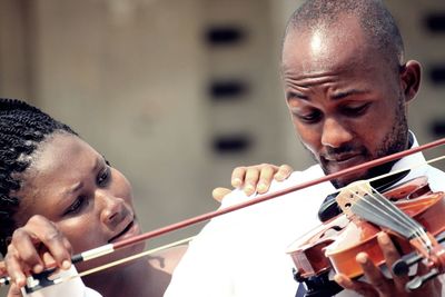 Portrait of a young man playing violin 