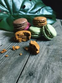 Close-up of macaroons on wooden table