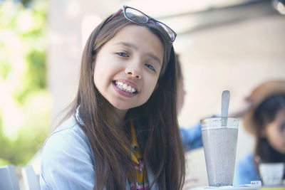 Portrait of a smiling girl with ice cream