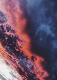 Low angle view of dramatic sky during sunset