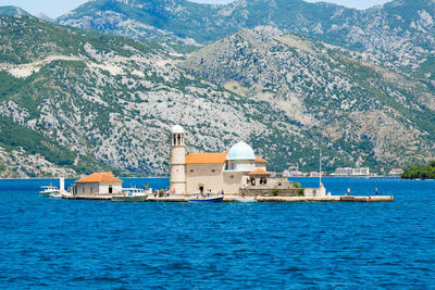 Our lady of the rock monastery on shaw island against mountains