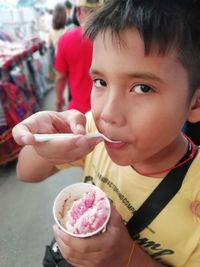 Portrait of boy holding ice cream