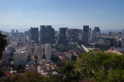 High angle view of buildings in city against sky