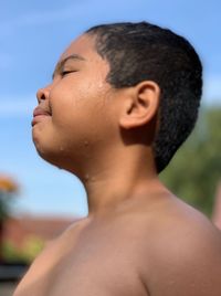 Close-up portrait of shirtless boy