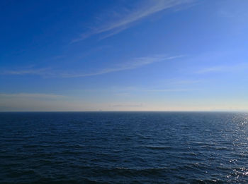 Scenic view of sea against blue sky