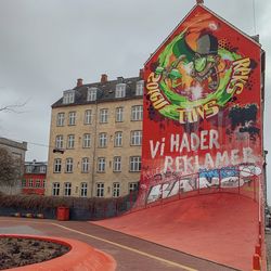 Graffiti on building against sky