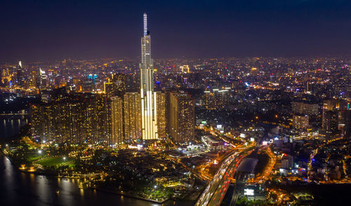 Illuminated buildings in city at night