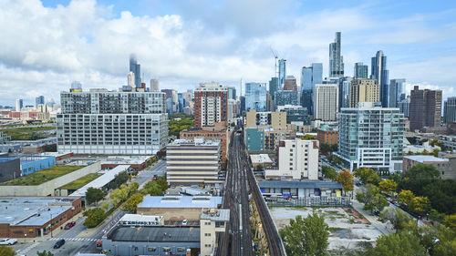 High angle view of buildings in city against sky