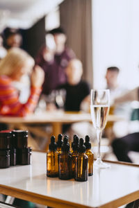 Merchandise bottles arranged on table during event at convention center