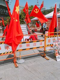 Red flags on street in city