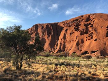 Rock formations on landscape against sky