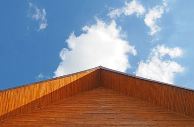 Low angle view of building against cloudy sky