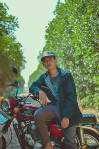 Portrait of smiling man riding motorcycle