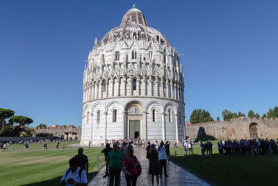 Group of people in front of historical building