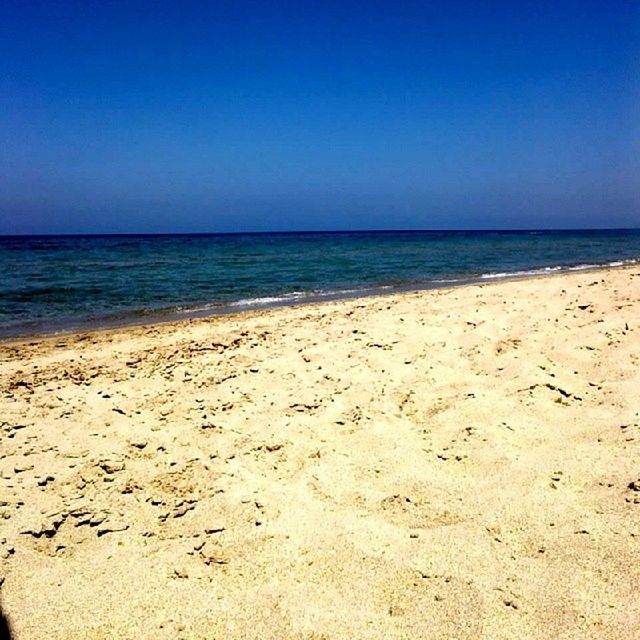 beach, sand, sea, clear sky, horizon over water, copy space, shore, water, tranquility, blue, tranquil scene, scenics, beauty in nature, nature, idyllic, coastline, day, remote, outdoors, wave