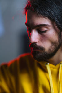 Close-up of young man looking away