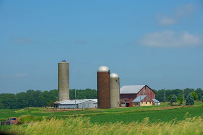 Built structure on field against sky