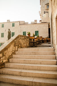 Low angle view of staircase against buildings