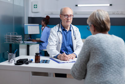 Portrait of female doctor working in office