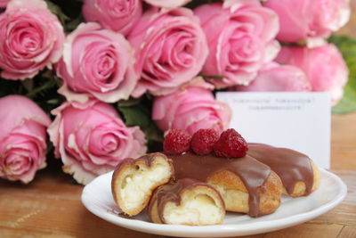 Close-up of pink roses on table