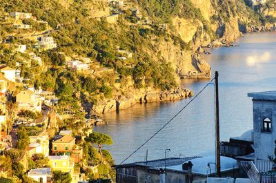 High angle view of townscape by sea