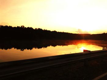 Scenic view of sunset over lake