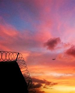 Low angle view of cloudy sky at sunset