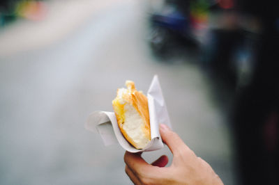 Close-up of hand holding food