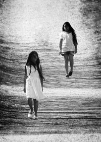 Full length of young woman walking outdoors