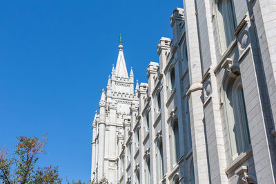 Low angle view of building against clear blue sky