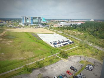 High angle view of road amidst buildings against sky