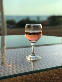 Close-up of wineglass on table