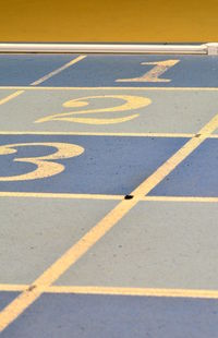 High angle view of arrow sign on road