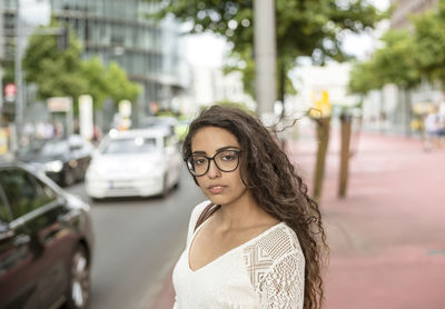 Portrait of young woman in car