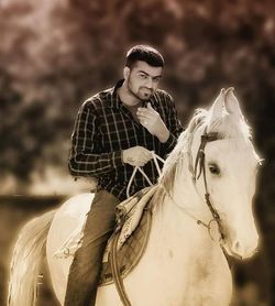 Portrait of young man riding outdoors