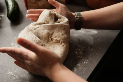 Cropped hand of person preparing food