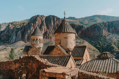 Old building with mountain range in background