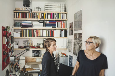 Female industrial designers talking at home office