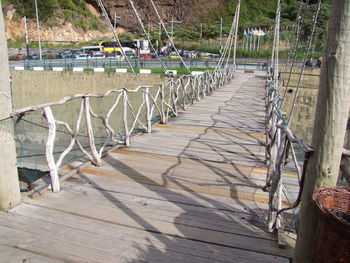 Wooden railing by water