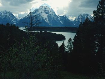 Scenic view of lake and mountains against sky