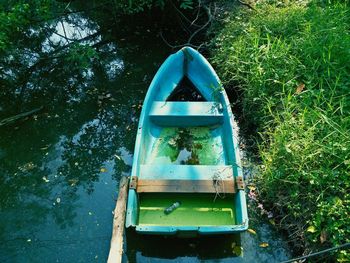 Boat in river by plants