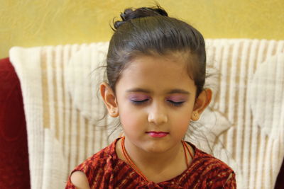 Close-up portrait of girl at home
